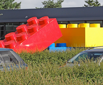 Giant red, yellow and blue Lego blocks ... bigger than a car